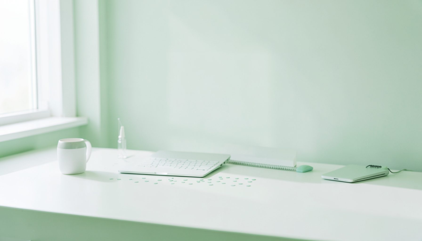 A minimalist coding workspace with a soft green and white palette, evoking clarity and foundational learning.