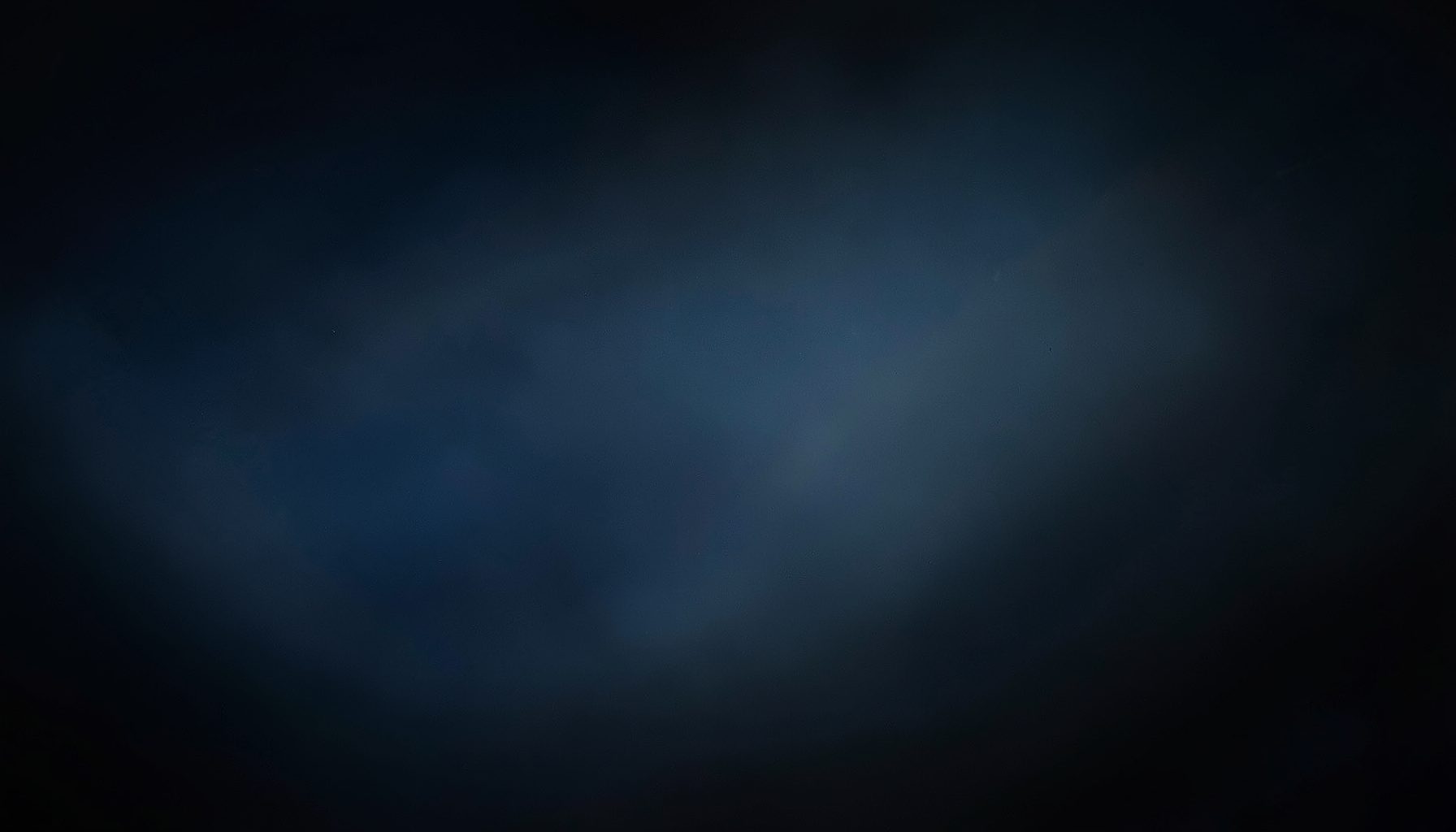 Dark abstract backdrop with subtle blue and gray gradients, evoking a technical cloud-computing atmosphere.